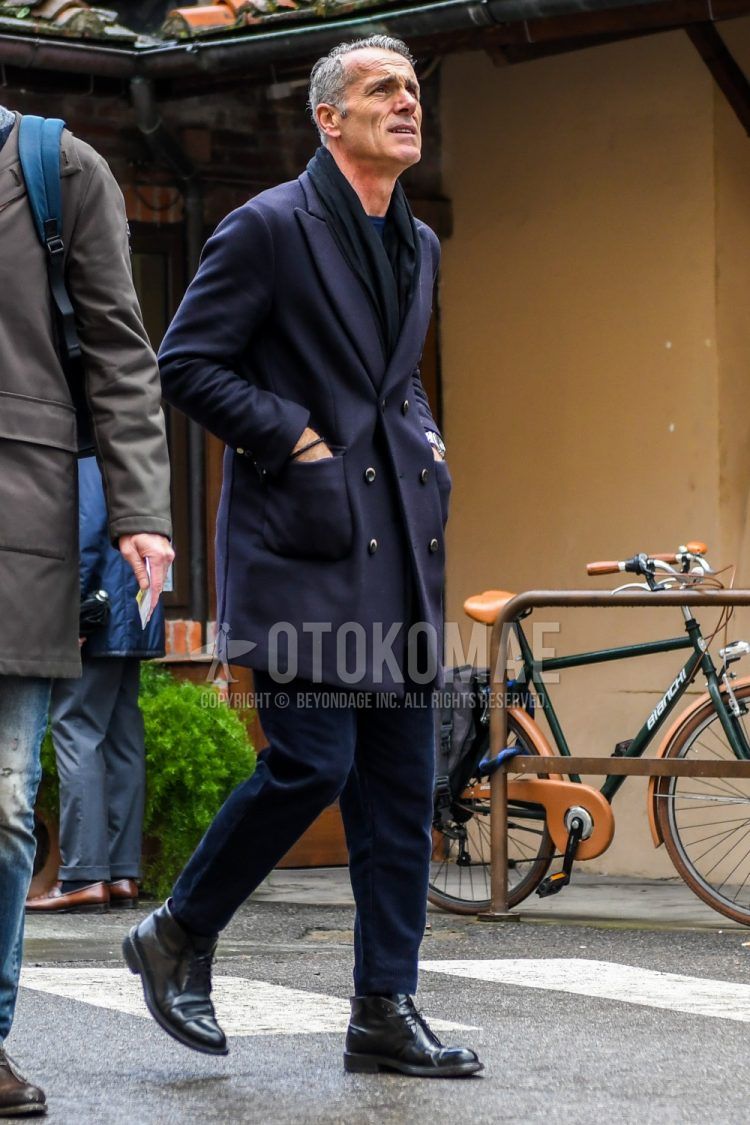 Winter men's coordinate outfit with plain black scarf/stall, plain navy chester coat, plain navy winter pants (corduroy,velour) and black chukka boots.