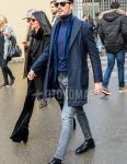 Men's coordinate and outfit with solid color sunglasses, solid color navy chester coat, solid color blue tailored jacket, solid color navy turtleneck knit, solid color gray denim/jeans, solid color black socks, and black coin loafer leather shoes.