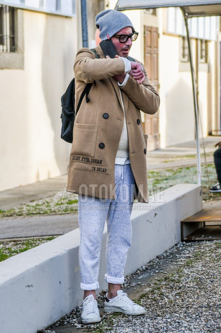 Men's coordinate and outfit with plain glasses, plain brown chester coat, plain white sweater, plain gray sweatpants, and white low-cut sneakers.
