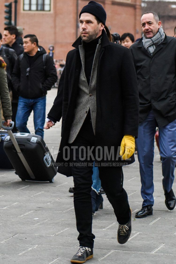 Men's coordinate and outfit with plain black knit cap, plain black chester coat, plain gray tailored jacket, plain black turtleneck knit, plain black denim/jeans and Maison Margiela German Trainers gray low-cut sneakers.
