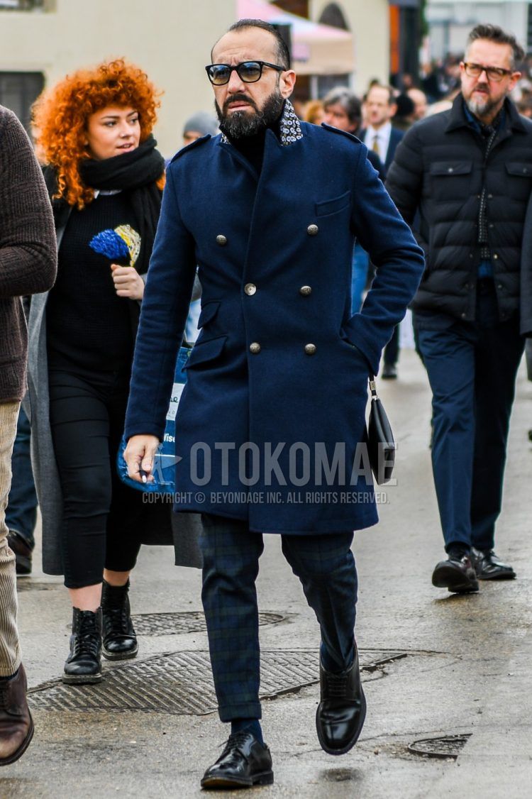Men's coordinate and outfit with plain sunglasses, plain navy chester coat, black/green checked slacks, plain black socks, and black plain toe leather shoes.
