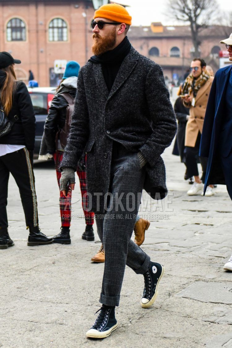 Men's outfit with plain orange knit cap, plain black Boston sunglasses, plain black scarf/stall, dark gray outer chester coat, plain black turtleneck knit, gray checked slacks, black high-cut Converse All Star sneakers. Outfit.