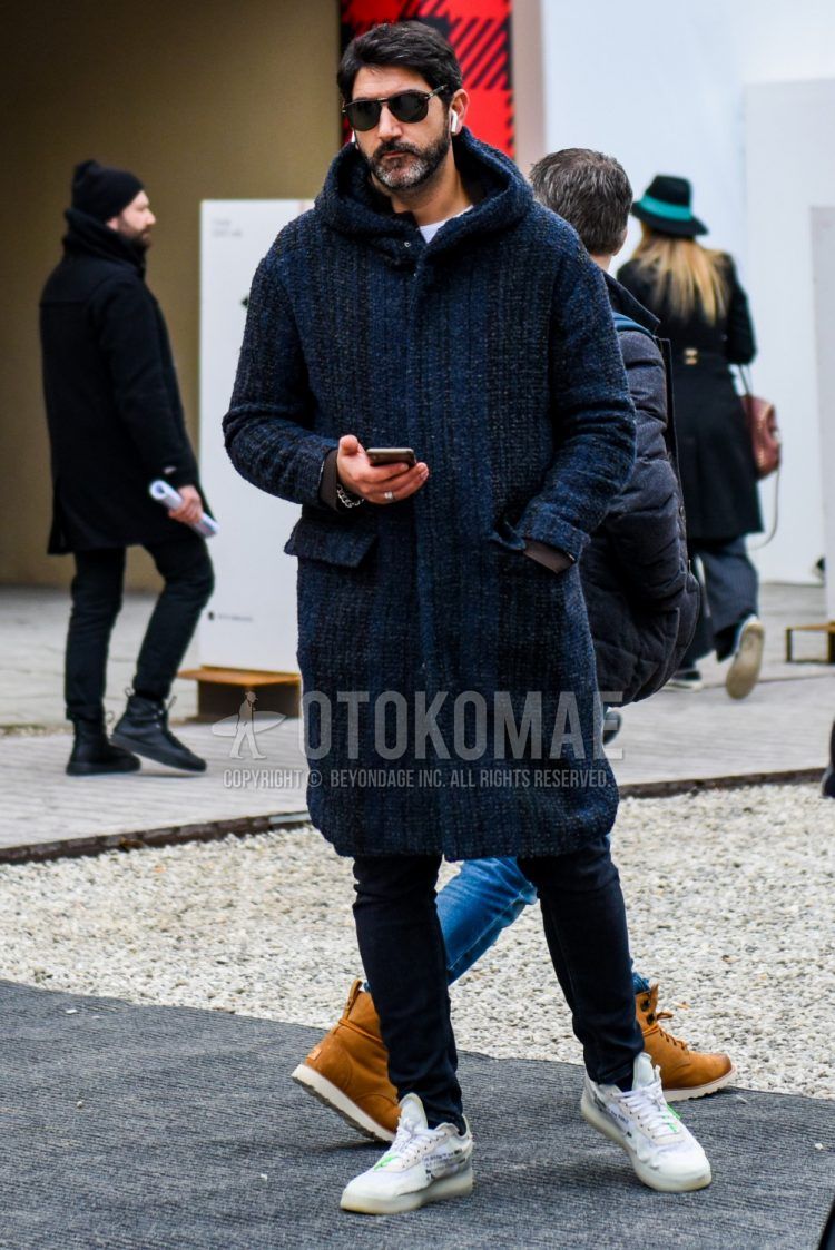 Men's coordinate and outfit with plain black sunglasses, navy outer hooded coat, plain white t-shirt, plain navy denim/jeans, and Nike Off White Zaten Air Force 1 white low-cut sneakers.