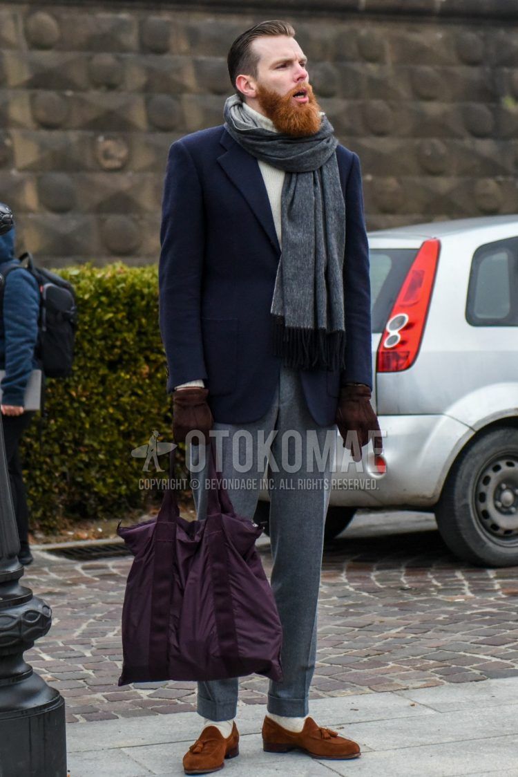 Men's coordinate and outfit with plain gray scarf/stall, plain navy tailored jacket, plain white turtleneck knit, plain gray wool slacks, plain white socks, brown tassel loafer leather shoes, and plain purple tote bag.