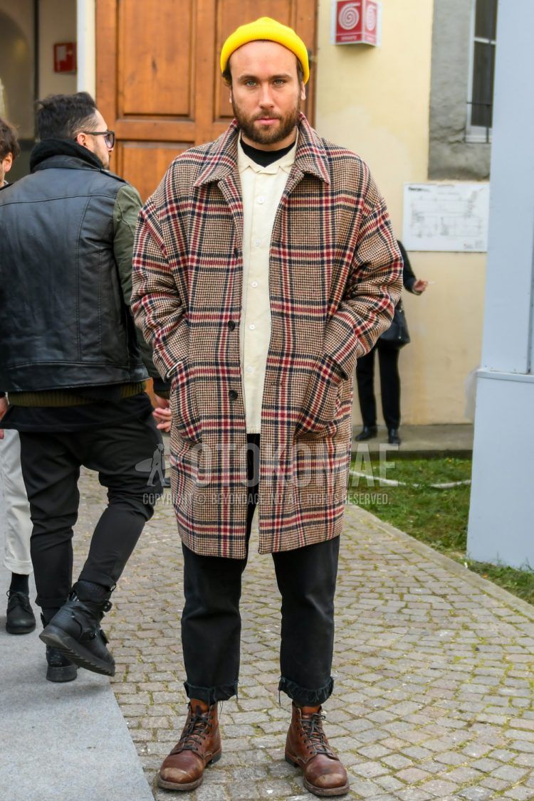 Men's coordinate and outfit with plain yellow knit cap, brown check stainless steel collar coat, plain beige shirt, plain black t-shirt, plain black cotton pants, and brown work boots.