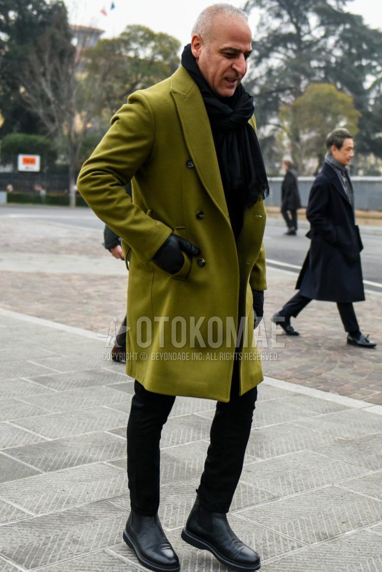 Men's coordinate and outfit with plain black scarf/stall, plain olive green chester coat, plain black skinny pants, plain black denim/jeans, and black side gore boots.