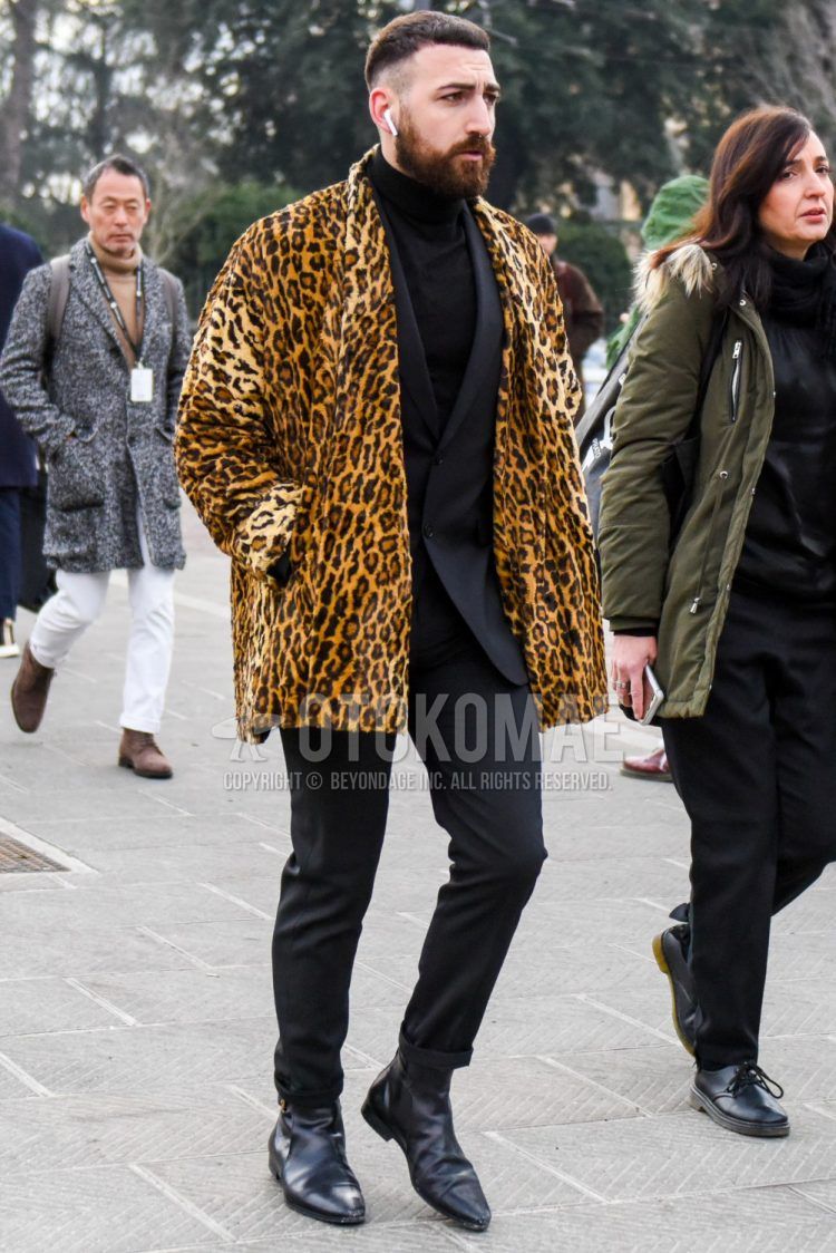 Men's coordinate and outfit with yellow leopard outerwear, plain black turtleneck knit, black boots, and dark gray plain suit.