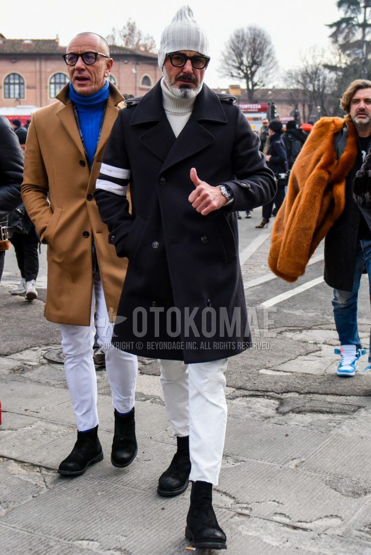 Men's coordinate and outfit with plain gray knit cap, plain glasses, plain black Ulster coat, plain white turtleneck knit, plain white cotton pants, and black boots.