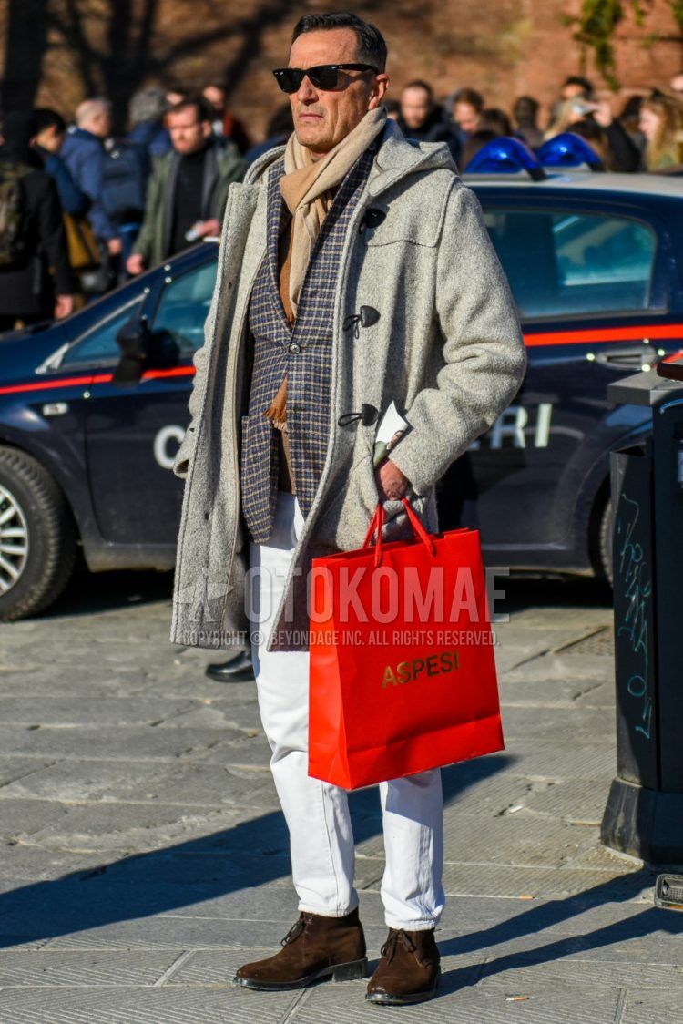 Men's coordinate and outfit with plain black sunglasses, plain beige scarf/stall, plain gray duffle coat, gray checked tailored jacket, plain white denim/jeans, and suede brown chukka boots.