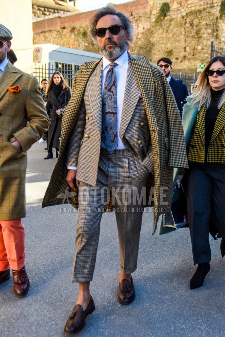 Men's Ray-Ban Wayfarer Wellington plain black sunglasses, beige checked chester coat, plain white shirt, brown tassel loafer leather shoes, beige checked suit, brown/gray paisley tie.