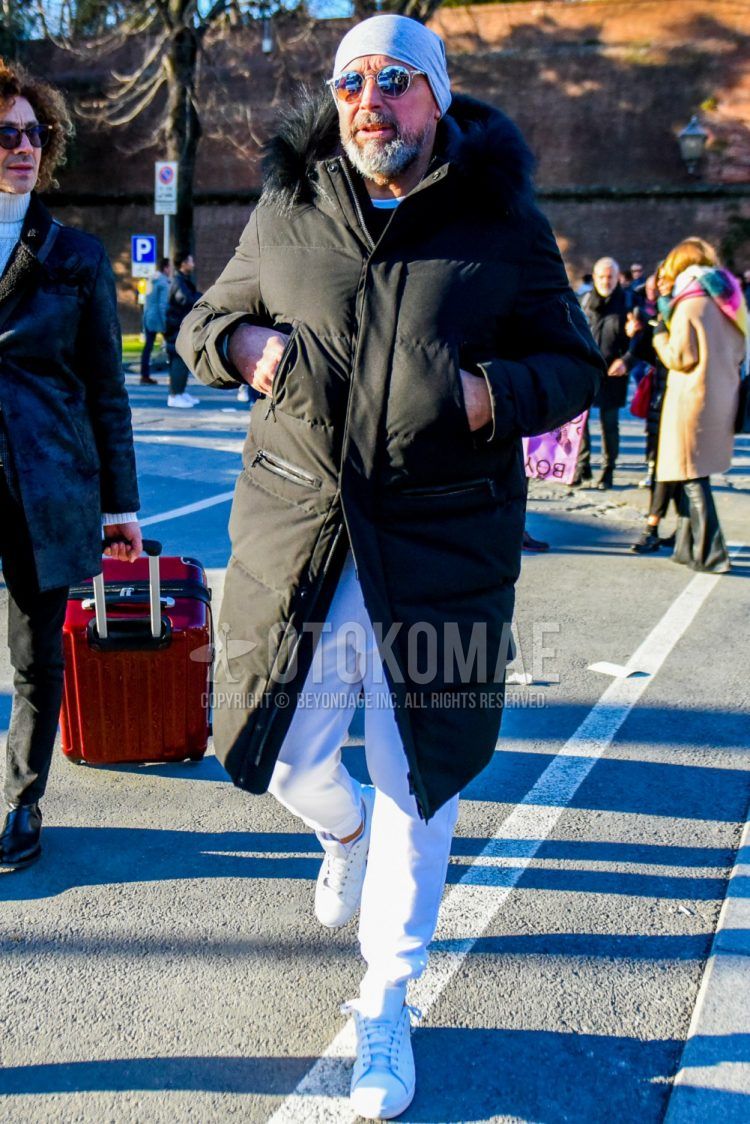 Men's coordination and outfit with plain gray knit cap, clear plain sunglasses, plain black down jacket, plain white sweatpants, plain white jogger pants/ribbed pants, and white low-cut sneakers.