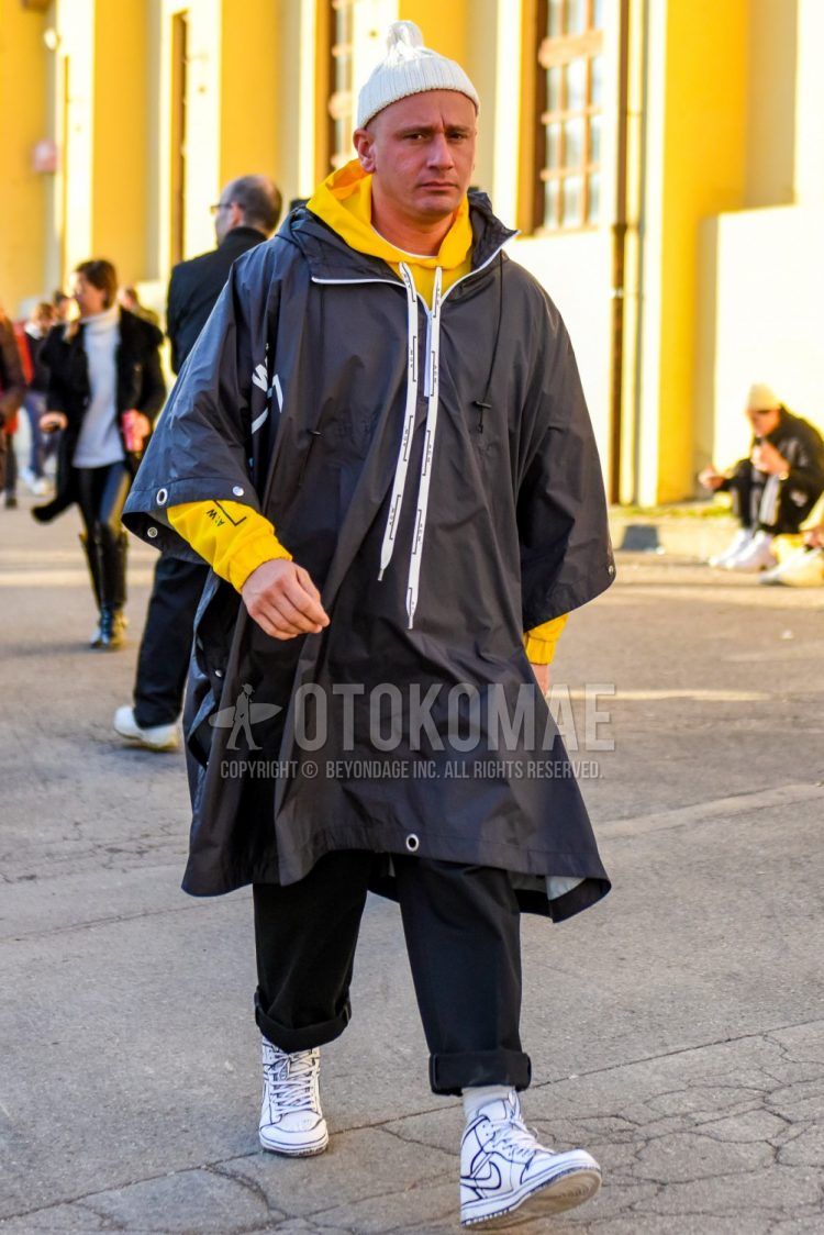 Men's coordinate and outfit with plain white knit cap, plain black outerwear from Acordwall, plain yellow hoodie from Acordwall, plain black cotton pants, plain white socks, and Nike Air Force 1 white high-cut sneakers.