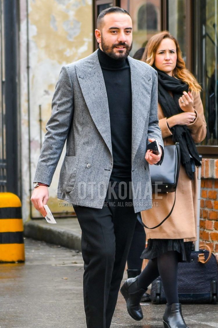 Men's coordination and outfit with plain gray tailored jacket, plain black turtleneck knit, plain black slacks, and red side gore boots.