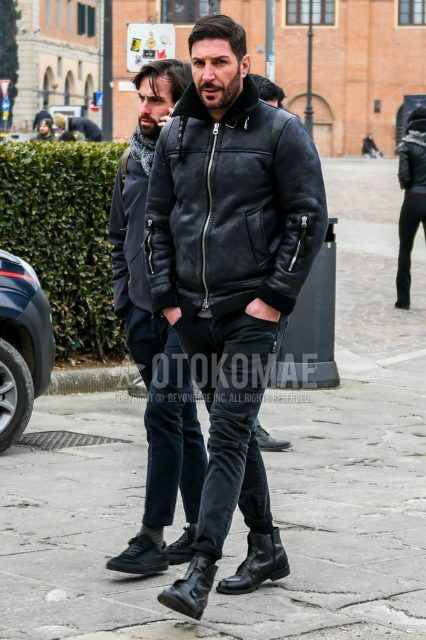 Men's coordinate and outfit with plain black leather jacket (other than rider's), plain black cotton pants and black boots.