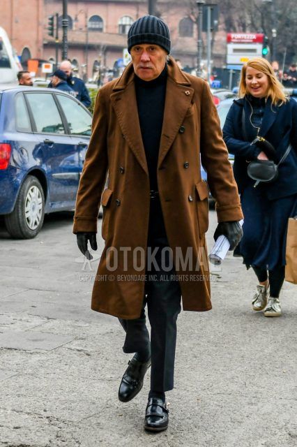 Men's coordinate and outfit with dark gray solid color knit cap, Lardini brown solid color Ulster coat, black solid color turtleneck knit, black solid color leather belt, gray solid color slacks, black solid color socks, black monk shoes leather shoes.