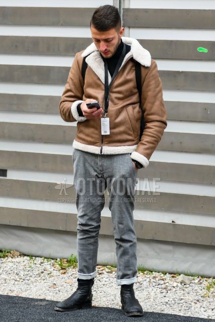 Men's coordinate and outfit with plain beige leather jacket (except rider's), plain black turtleneck knit, gray checked cotton pants, and black boots.