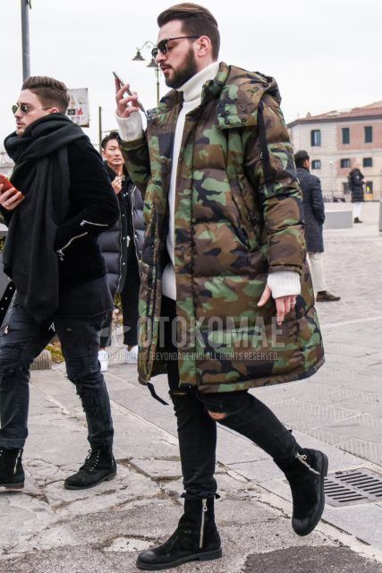Men's coordinate and outfit with plain sunglasses, multi-colored camouflage down jacket, plain white turtleneck knit, plain black damaged jeans, and black boots.