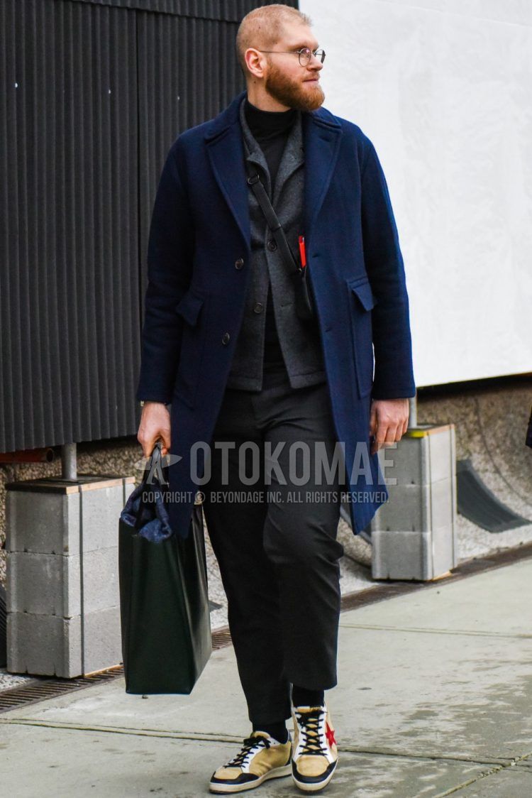 Winter men's coordinate and outfit with plain silver glasses, plain navy chester coat, plain gray outerwear, plain black turtleneck knit, plain dark gray slacks, plain black socks, beige low-cut sneakers, and plain black tote bag.