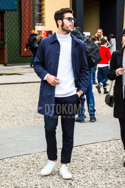 Men's coordinate and outfit with plain sunglasses, plain navy stainless steel collar coat, plain white turtleneck knit, plain gray slacks, and white sneakers.