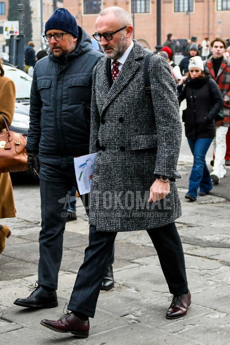 Men's coordinate and outfit with plain glasses, gray checked chester coat, plain white shirt, plain black socks, plain toe leather shoes, black checked suit, and red dot tie.
