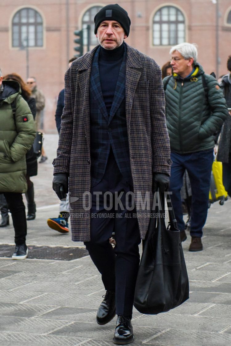 Men's coordinate and outfit with plain black knit cap, navy check tailored jacket, plain navy turtleneck knit, plain navy slacks, black plain toe leather shoes, and plain black tote bag.