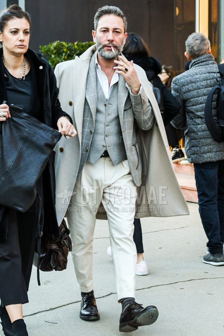 Men's coordinate and outfit with plain white chester coat, gray checked tailored jacket, plain gray gilet, plain white shirt, plain white bottoms, black striped socks, and black plain toe leather shoes.