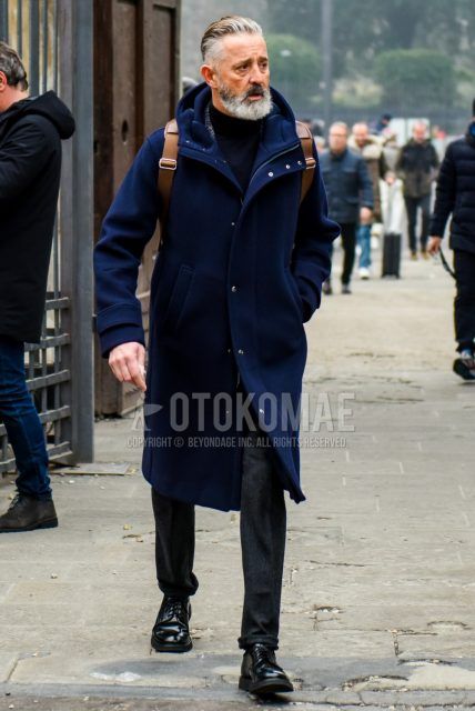 Men's coordinate and outfit with plain navy hooded coat, plain black turtleneck knit, wool dark gray solid bottoms, and black plain toe leather shoes.