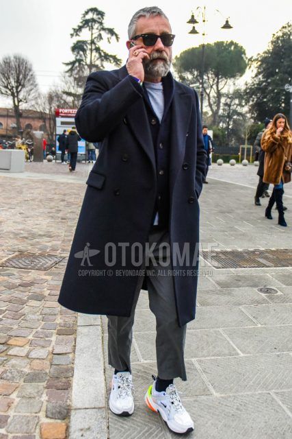 Men's coordinate and outfit with plain sunglasses, plain navy chester coat, plain navy cardigan, plain gray t-shirt, plain gray ankle pants, plain navy socks, and Nike M2K Tekno white low-cut sneakers.
