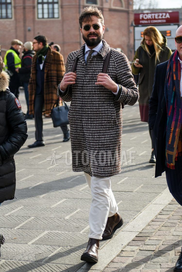 Winter men's coordinate and outfit with plain silver sunglasses, white and black checked stainless steel coat, plain white shirt, plain white cotton pants, brown side gore boots, and brown small print tie.