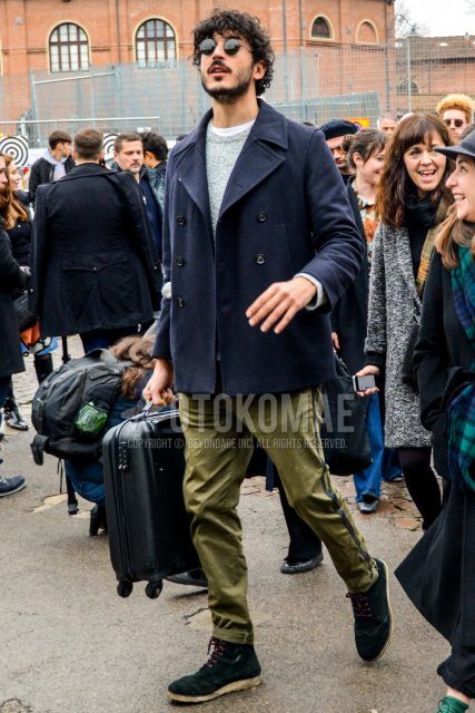 Men's coordinate and outfit with plain sunglasses, plain navy P-coat, plain gray sweater, plain olive green sidelined pants, and green boots.