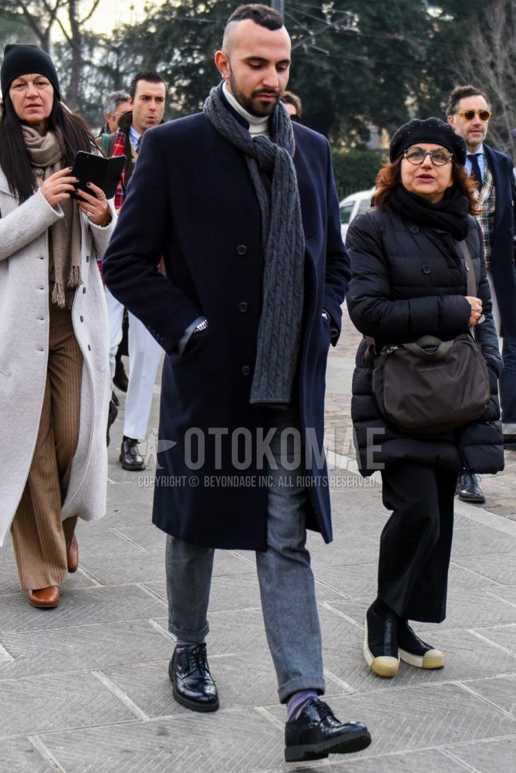 Men's coordinate and outfit with plain gray scarf/stall, plain navy chester coat, plain white turtleneck knit, plain gray slacks, purple striped socks, and black wingtip leather shoes.
