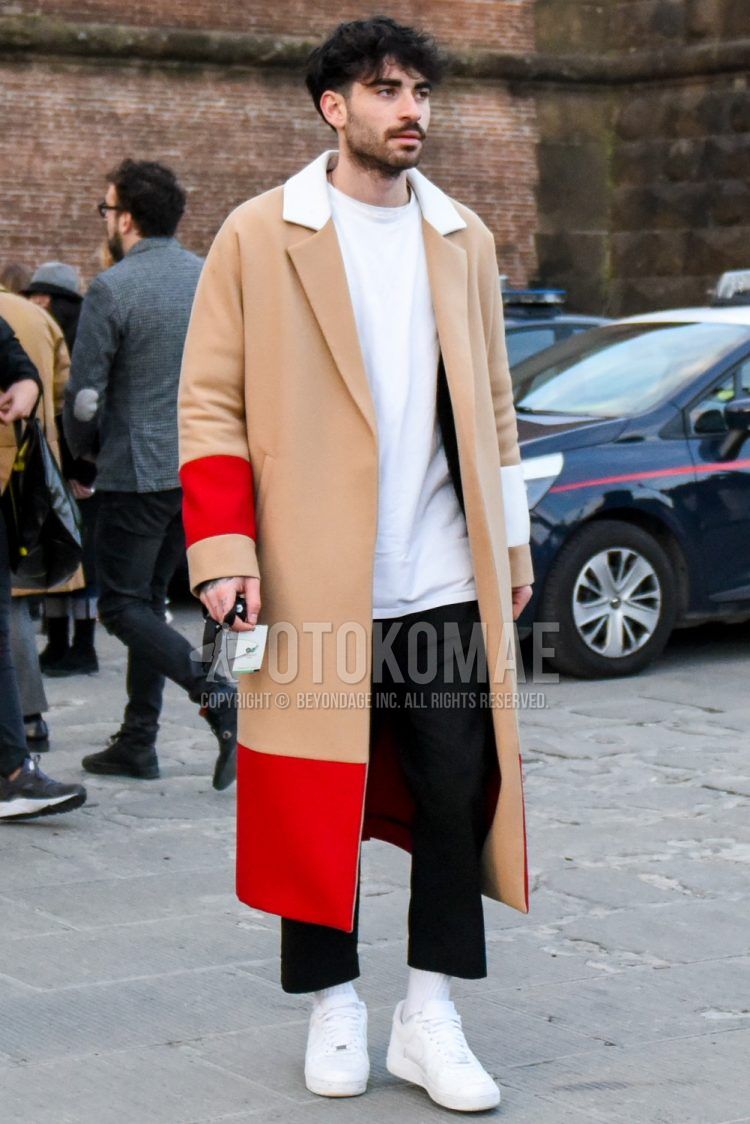 Men's fall/winter coordinate and outfit with plain beige chester coat, plain white t-shirt, plain black wide-leg pants, plain white socks, and white low-cut Nike sneakers.