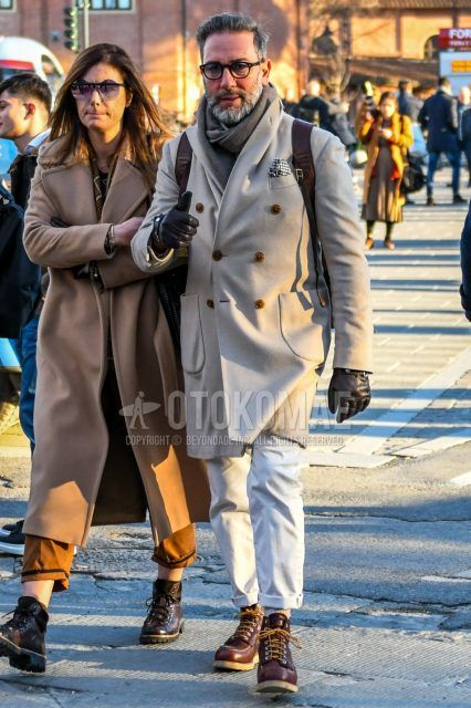 Men's coordinate and outfit with plain glasses, plain gray scarf/stall, plain beige chester coat, plain white cotton pants, and brown work boots.
