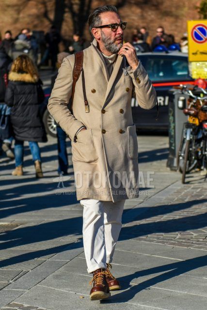 Men's coordinate and outfit with plain black glasses, plain beige chester coat, plain beige turtleneck knit, plain white cotton pants, and Red Wing Irish Setter brown work boots.