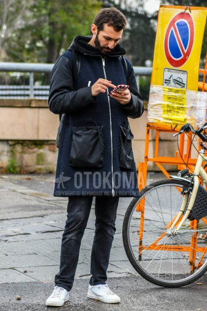Men's coordinate and outfit with navy solid color hooded coat, dark gray solid color denim/jeans, and white low-cut sneakers.