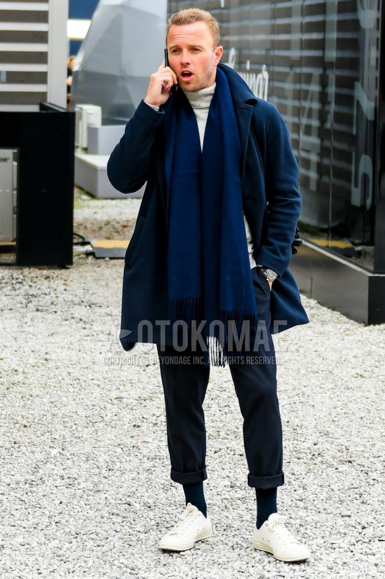 Men's coordinate and outfit with plain navy scarf/stall, plain navy stainless coat, plain gray turtleneck knit, plain navy slacks, plain navy socks, and white low-cut sneakers.