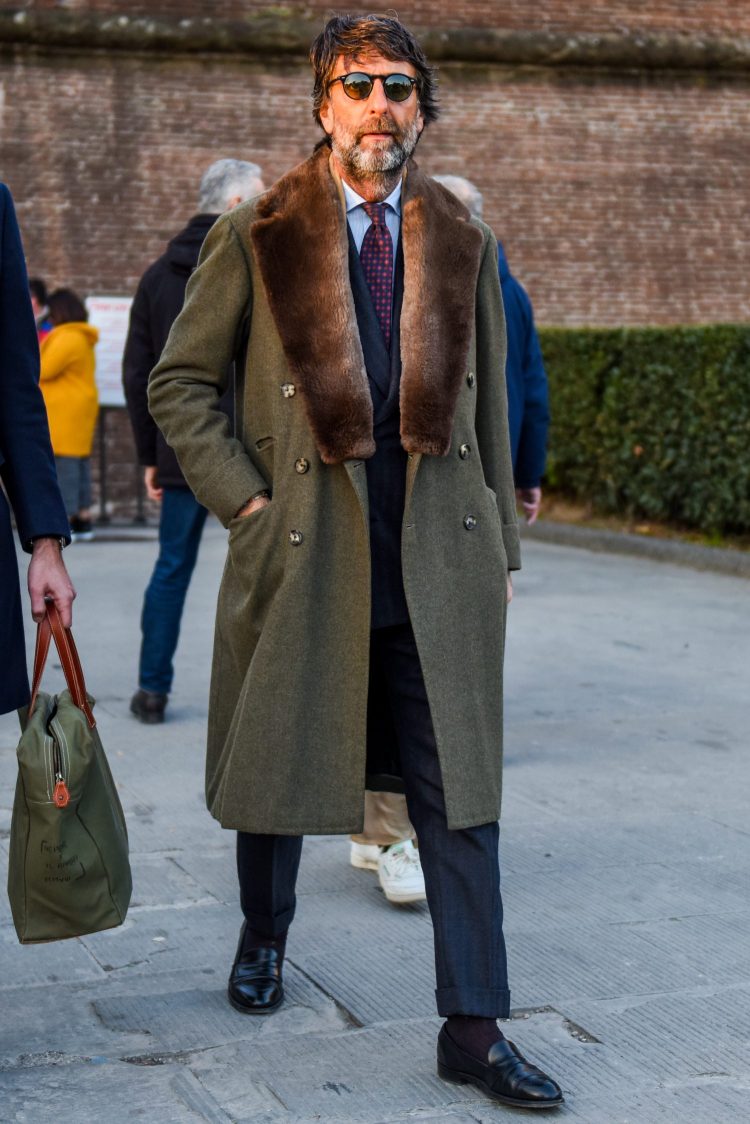 Suit style upgraded with a rich, fur-lined chester coat