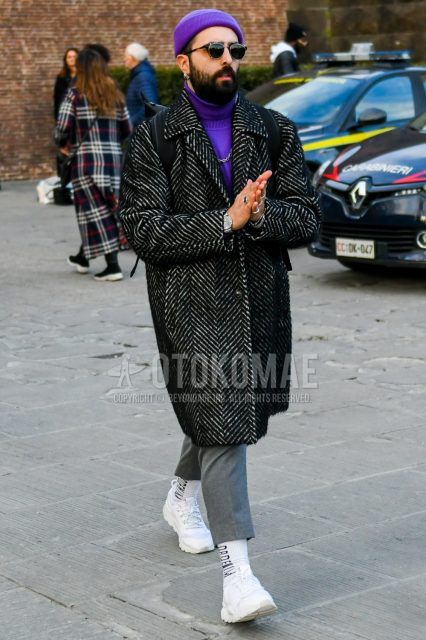 Winter men's coordinate and outfit with solid purple knit cap, brown tortoiseshell sunglasses, dark gray herringbone stainless steel coat, solid purple turtleneck knit, solid gray slacks, white graphic socks, and white low-cut sneakers.
