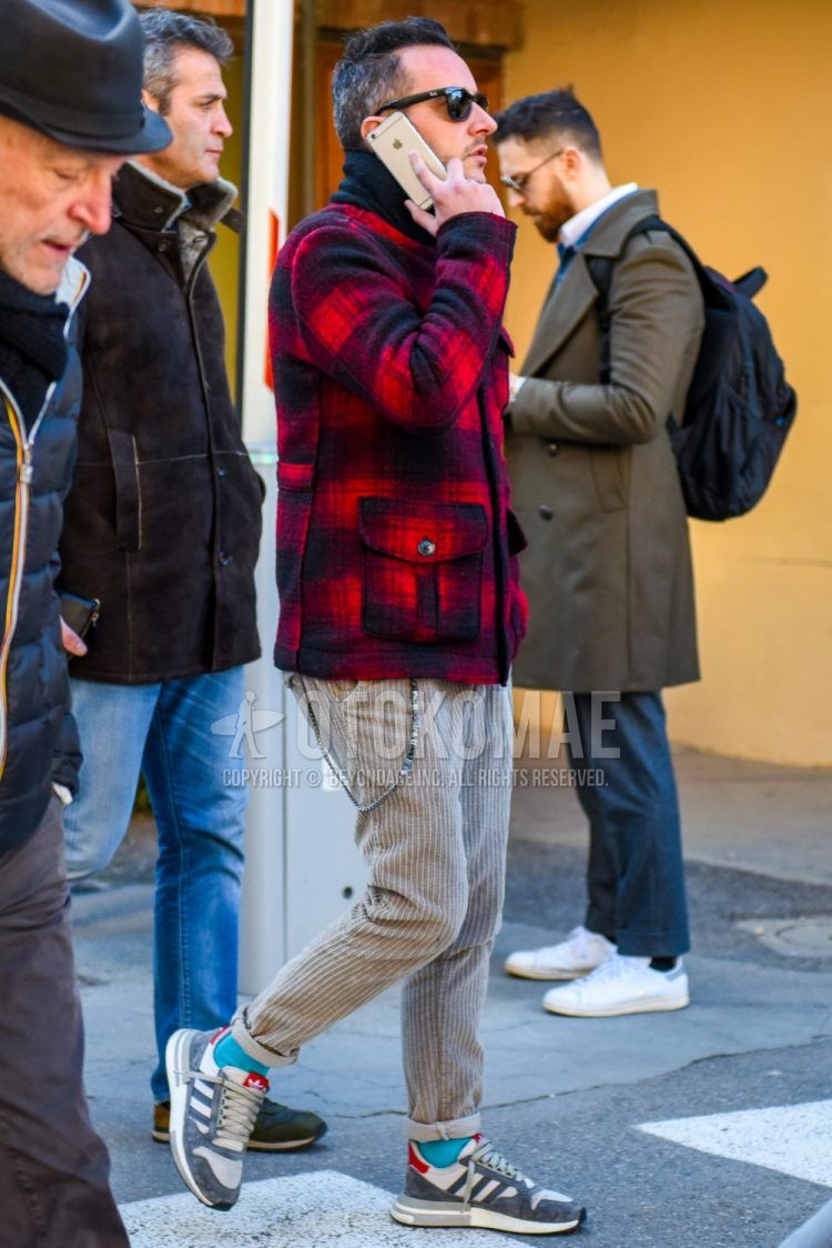 Men's coordinate and outfit with Ray-Ban solid black sunglasses, red/black checked outerwear, solid beige winter pants (corduroy,velour), solid light blue socks, Adidas ZX500RM gray low-cut sneakers.