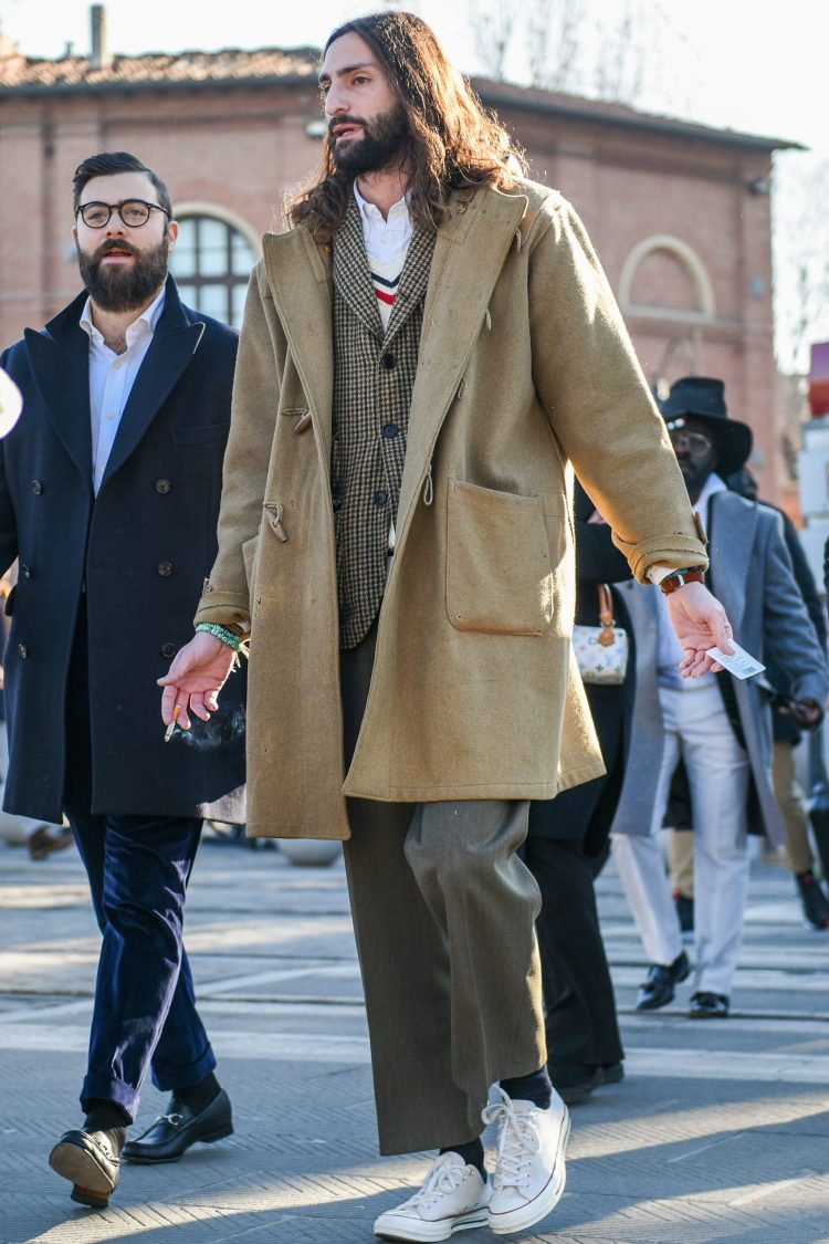 Oversized duffle coat and wide slacks express an effortless, shoulderless look