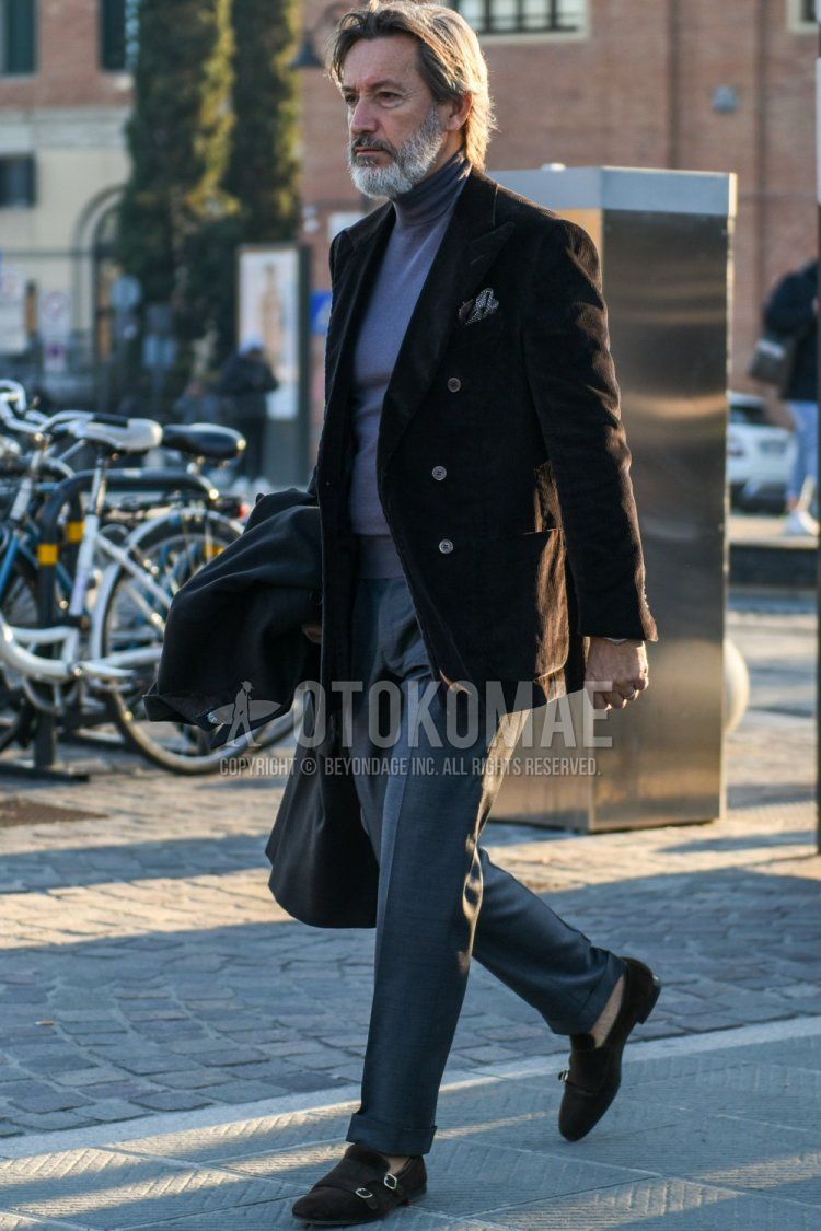 Men's fall/spring outfit with plain brown tailored jacket, plain gray turtleneck knit, plain gray slacks, and suede brown monk leather shoes.