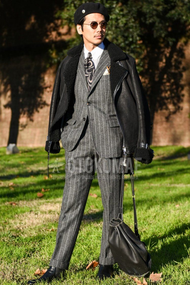 Men's fall/spring outfit and outfit with plain black hat, plain black sunglasses, plain black leather jacket (not riders), plain white shirt, black boots, plain black shoulder bag, gray striped suit, black tie tie.
