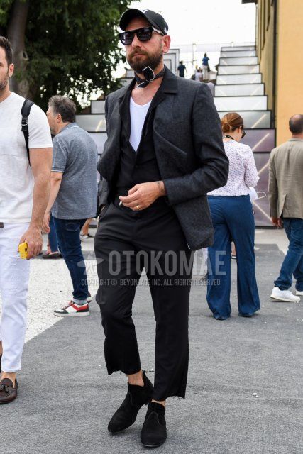 Men's coordination and outfit with plain black baseball cap, plain black sunglasses, plain black bandana/neckerchief, plain dark gray tailored jacket, plain white t-shirt, plain black shirt, plain black cropped pants, and black boots.