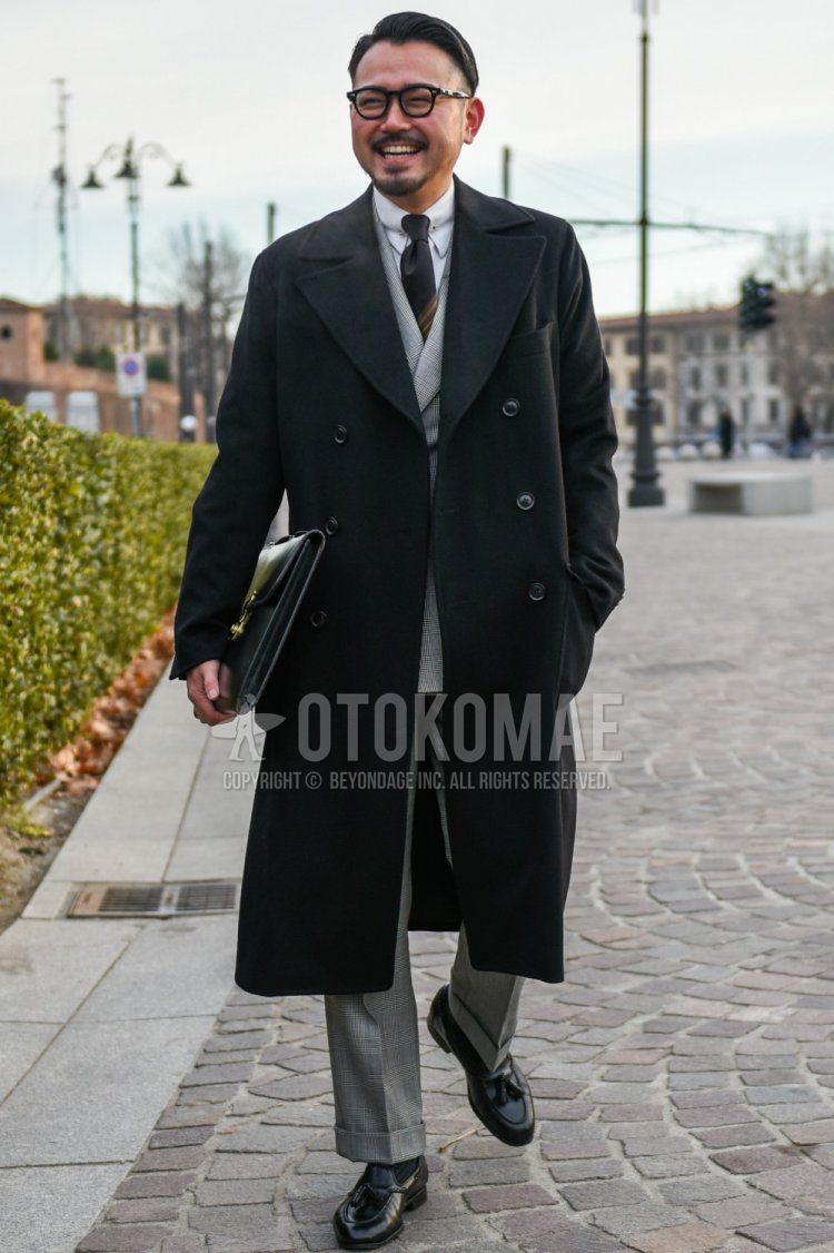Men's winter/autumn coordinate and outfit with plain black glasses, plain black chester coat, plain white shirt, plain black socks, plain black tassel loafer leather shoes, plain gray suit, and brown regimental tie.