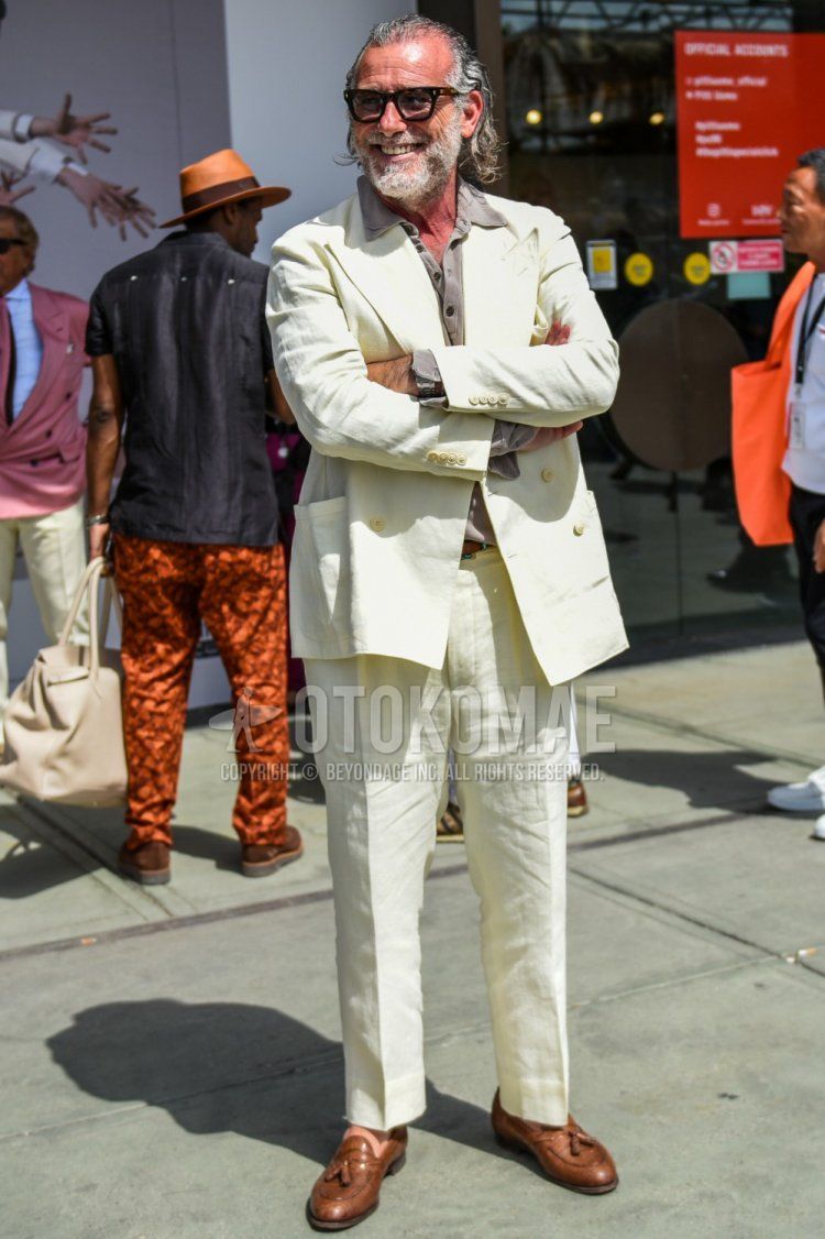 Men's spring and summer coordinate and outfit with plain brown sunglasses, pullover plain gray shirt, brown tassel loafer leather shoes, and plain white suit.