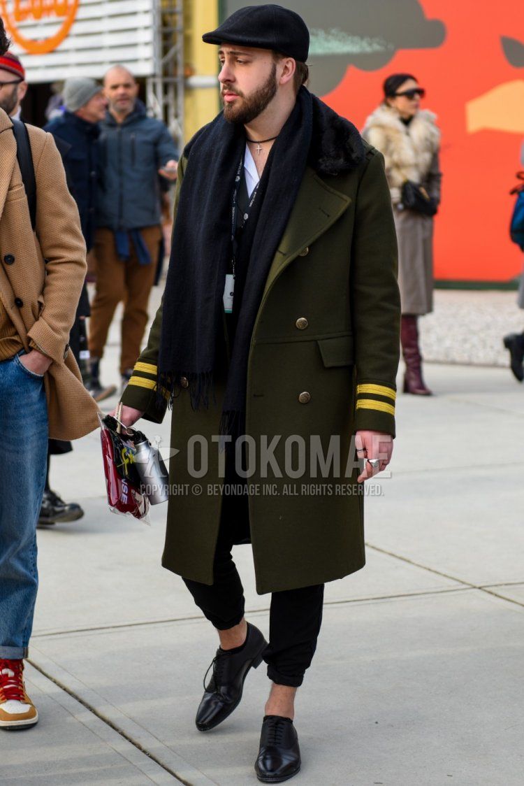 Men's fall/winter outfit with plain black hunting cap, plain dark gray scarf/stall, plain olive green Ulster coat, plain white shirt, plain black cotton pants, and black straight tip leather shoes.
