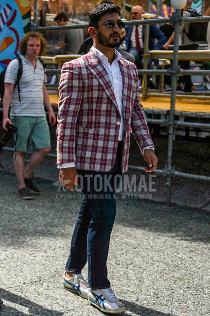 Men's coordinate and outfit with plain gray sunglasses, red checked tailored jacket, plain white shirt, plain navy denim/jeans, and white low-cut Onitsuka Tiger sneakers.