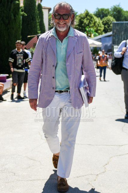 Men's coordinate and outfit with Wellington brown tortoiseshell sunglasses, red striped tailored jacket, plain green polo shirt, plain black leather belt, plain white ankle pants, plain cotton pants, and suede brown tassel loafer leather shoes.