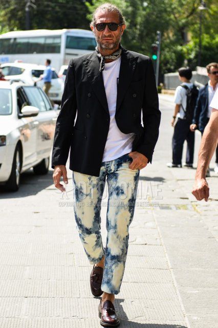 Men's coordinate and outfit with plain black sunglasses, black paisley bandana/neckerchief, plain black tailored jacket, plain white t-shirt, plain white/blue denim/jeans, brown tassel loafer leather shoes.