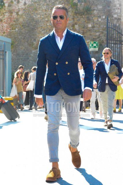 Men's coordinate and outfit with plain sunglasses, plain navy tailored jacket, plain white shirt, plain gray denim/jeans, beige monk shoes leather shoes, suede shoes leather shoes.